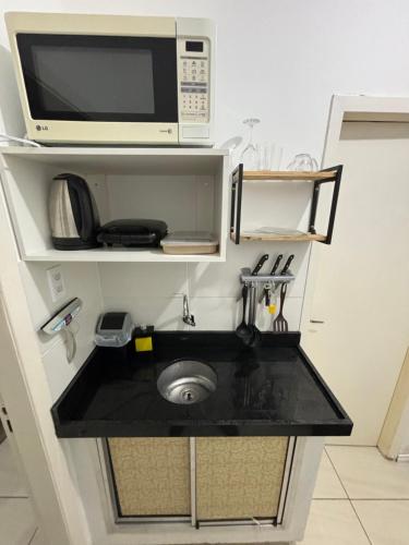 Η κουζίνα ή μικρή κουζίνα στο Apt proximo Santa casa UFRGS Centro