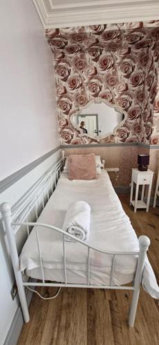 Cama o camas de una habitación en LilyRose Hotel