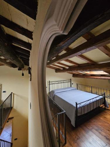 a bedroom with a large bed in a building at Casa del Podestà - Montopoli Val d'Arno in Montopoli in Val dʼArno