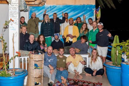 a group of people posing for a picture at Hostel The Endless House Anchor point in Taghazout