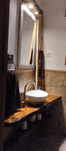 a bathroom with a sink and a mirror at Alpujarra Casa Fortuna in Mecina Fondales