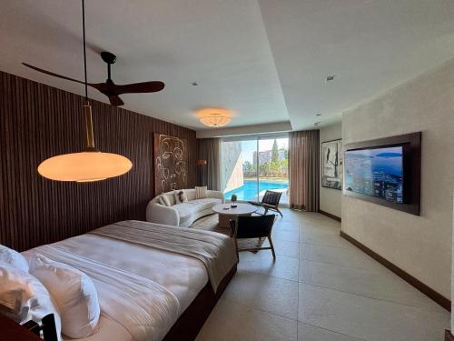 Katil atau katil-katil dalam bilik di Mavilu Luxury Hotel