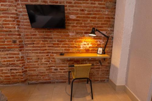 Una televisión o centro de entretenimiento en Casa Agena