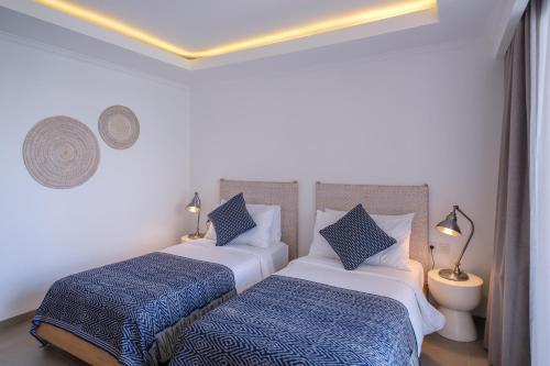 Ibus Beach Hotelにあるベッド