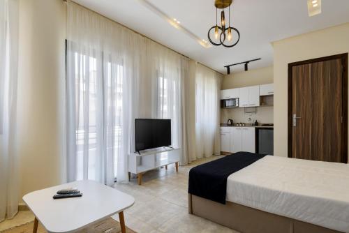 Μια τηλεόραση ή/και κέντρο ψυχαγωγίας στο Nomads Residence by Travelholic