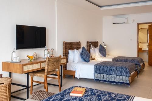 Ibus Beach Hotelにあるベッド
