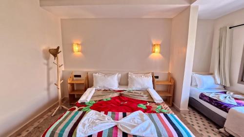 Cama o camas de una habitación en Atlas Berber Lodge