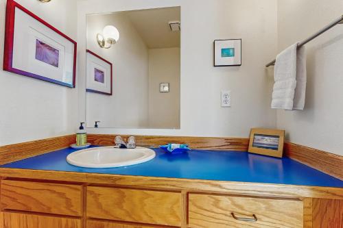 a bathroom with a sink and a mirror at Seascape One MCA 1154 in Manzanita