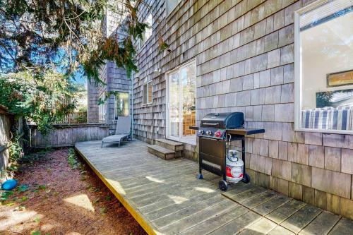 a patio with a grill next to a house at Seascape One MCA 1154 in Manzanita