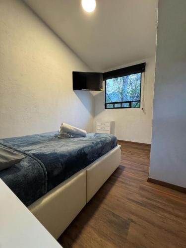 Ένα ή περισσότερα κρεβάτια σε δωμάτιο στο Casa Evelia