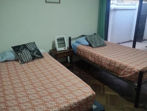 Postel nebo postele na pokoji v ubytování Casita Manquehue