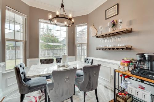 a dining room with a table and chairs at 14 Mi to Augusta! Family Home with Pet-Friendly Yard in Evans