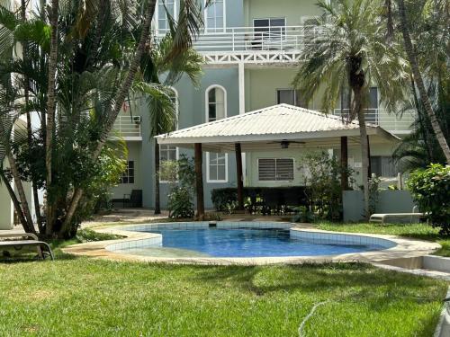 a swimming pool in front of a building at Private Condo with Pool in Tamarindo, Guanacaste in Tamarindo