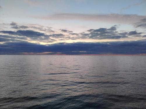 a large body of water with a cloudy sky at 6 person holiday home in Horslunde in Horslunde
