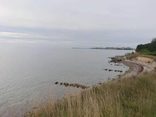 a large body of water with rocks in it at 6 person holiday home in Karrebæksminde-By Traum in Karrebæksminde