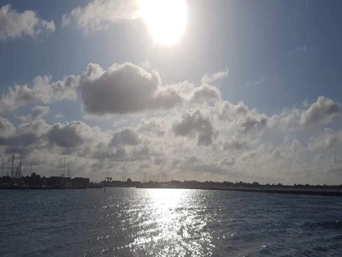 a view of the sun reflecting on the water at 6 person holiday home in Karrebæksminde-By Traum in Karrebæksminde