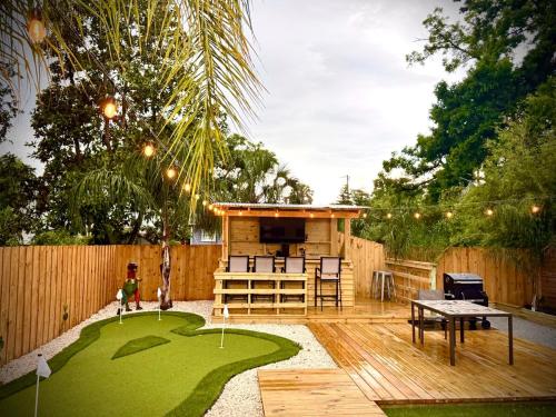 a miniature golf course in a backyard with a house at Downtown Historic St Augustine! Quality, Comfort, Hospitality, FUN! putt putt in St. Augustine