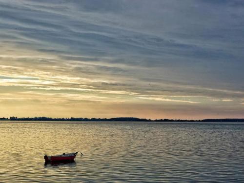 a boat in the middle of a large body of water at holiday home in Stubbekøbing-By Traum in Stubbekøbing