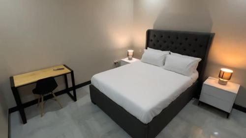 Cama o camas de una habitación en Palms & Pebbles Lodge