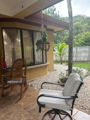 a patio with a chair and a chair swing at Casa Mathi in Portegolpe
