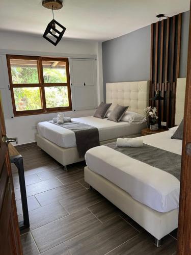 Ένα ή περισσότερα κρεβάτια σε δωμάτιο στο Apartamento Campestre Jericó Antioquía La Esmeralda
