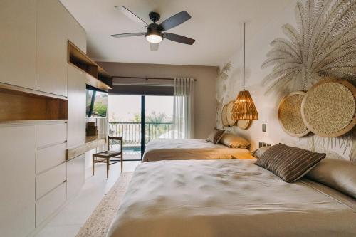 Ένα ή περισσότερα κρεβάτια σε δωμάτιο στο Palmas Apartment with Private Pool in Huatulco Bays