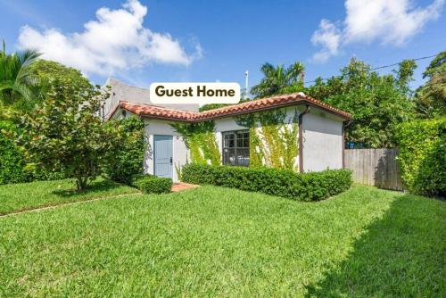a guest house with a sign that reads guest home at Spanish Charm 4br Guest House Private Yard in West Palm Beach