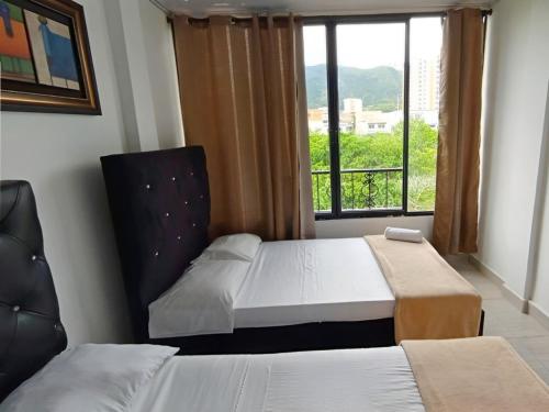 Postel nebo postele na pokoji v ubytování Apartamentos Family