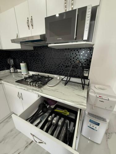 a kitchen with a stove and a counter top at Hotel Gesa in Villa Corona
