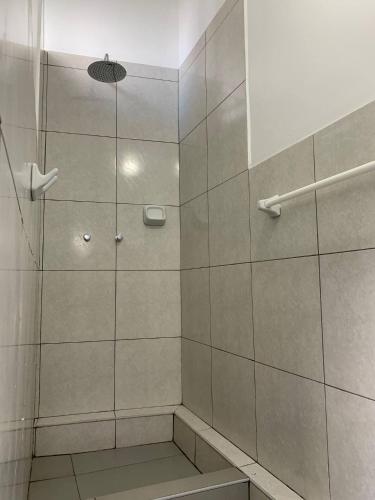 a shower with a glass door in a bathroom at Habitación matrimonial con jacuzzi in Huayllabamba
