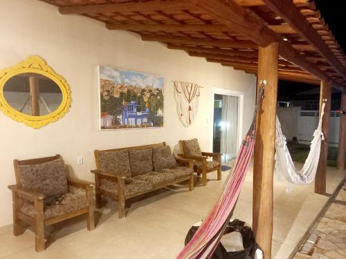 Ruang duduk di SUÍTE EM MASSARANDUPIÓ - RECANTO dos SONHOS
