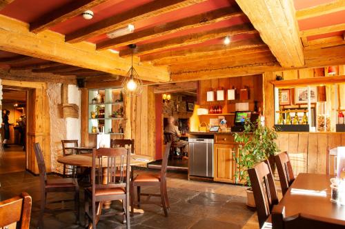a dining room with a table and chairs at Barn Owl Inn in Newton Abbot
