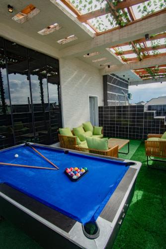 a pool table in the middle of a room at Lily Luxury Home Shortlet Apartments 