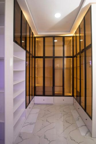a walk in closet with glass doors and marble floors at Lily Luxury Home Shortlet Apartments 