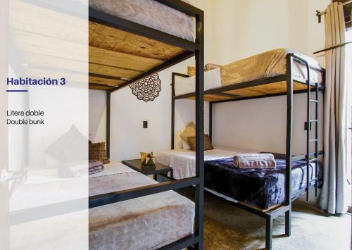 a room with two bunk beds in it at Spacious and Modern Cabin in Tapalpa, 5 Bedrooms in Tapalpa