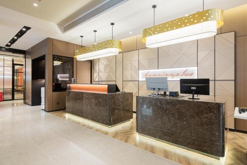 an office with a lobby with a reception desk at HomeInn Plus in Beijing