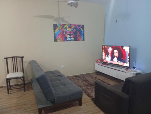 Телевизор и/или развлекательный центр в Casa Pé na Areia