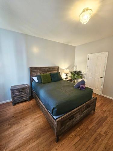 a bedroom with a large bed in a room at Luxury Villa- Hot Tub-King Bed Suite-Fenced Yard-Game Room-Fire Pit-Ski in East Stroudsburg