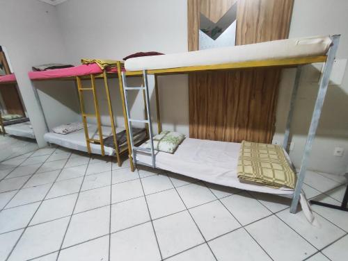 Ένα ή περισσότερα κρεβάτια σε δωμάτιο στο Pousada Nova Jerusalém