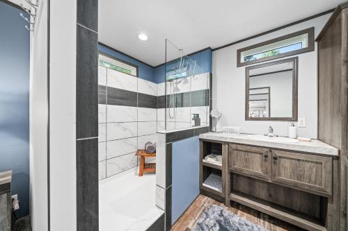 a bathroom with a sink and a shower at Bon Air Bungalow in Sparta