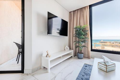 a living room with a view of the ocean at Nabeel Homes - Seaview Building - 3 Units in Gleem in Alexandria