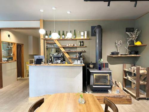 a kitchen with a table and a stove at RONENAI BASE - Vacation STAY 87314v in Shibinai