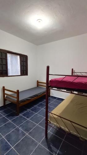 Llit o llits en una habitació de Puruba House