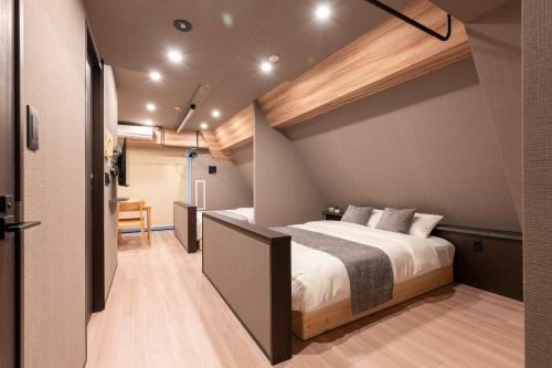 a bedroom with a large bed in a room at ACROSS Akihabara in Tokyo