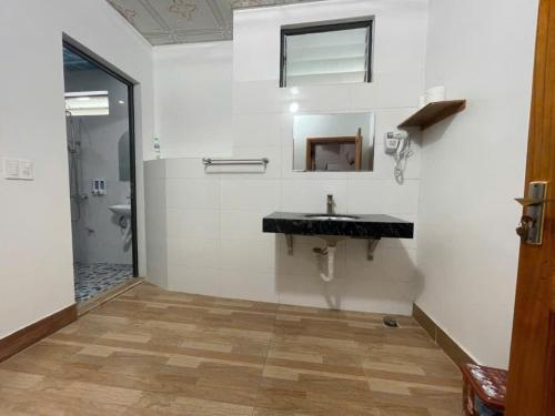 a bathroom with a sink and a toilet at Sky Bay Lodge in Ha Giang