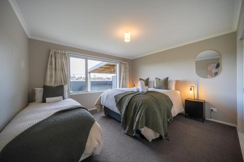 Postel nebo postele na pokoji v ubytování Fiordland Vista Lodge - Te Anau Holiday Home