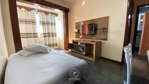 Postel nebo postele na pokoji v ubytování Apto central em Torres - Apenas 250 mts do mar - Ar condicionado - TV Smart - Wifi - Roupa de cama e Banho - Garagem - Cozinho completa - Aceita Pet