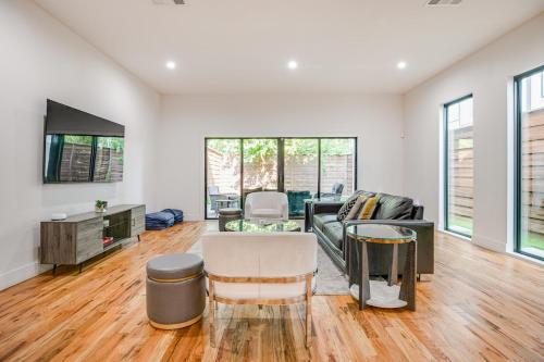 a living room with a couch and a table at Uptown Dallas Modern Retreat in Dallas