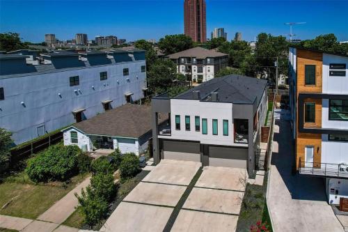 an overhead view of a building in a city at Uptown Dallas Modern Retreat in Dallas