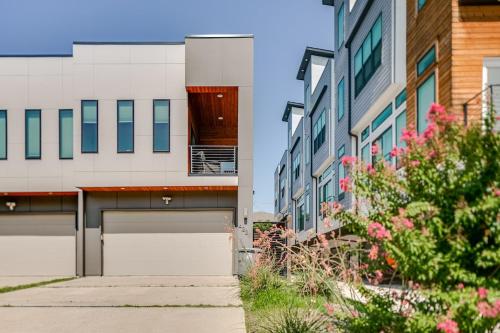 a building with a garage in a city at Uptown Dallas Modern Retreat in Dallas